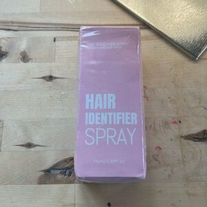 Packaged box of hair identifying spray for dermaplaning